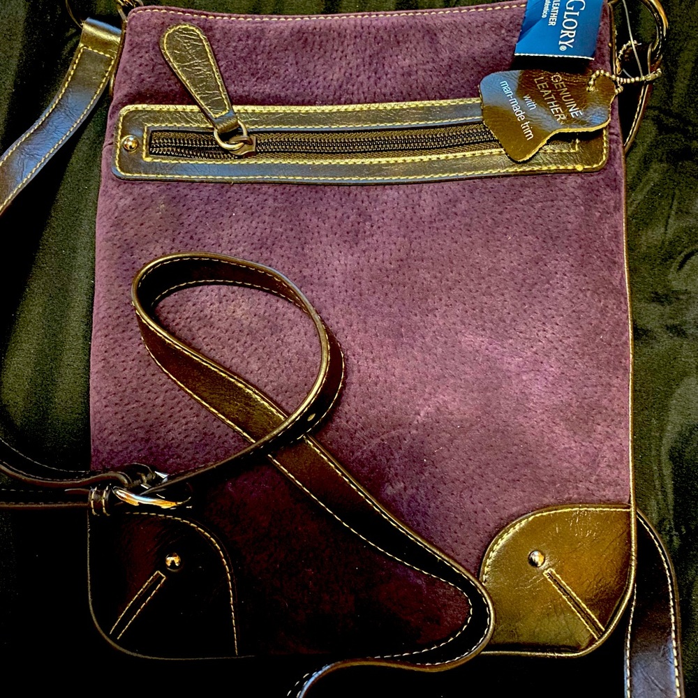 NWT.  Genuine leather purple pocketbook.. NEW